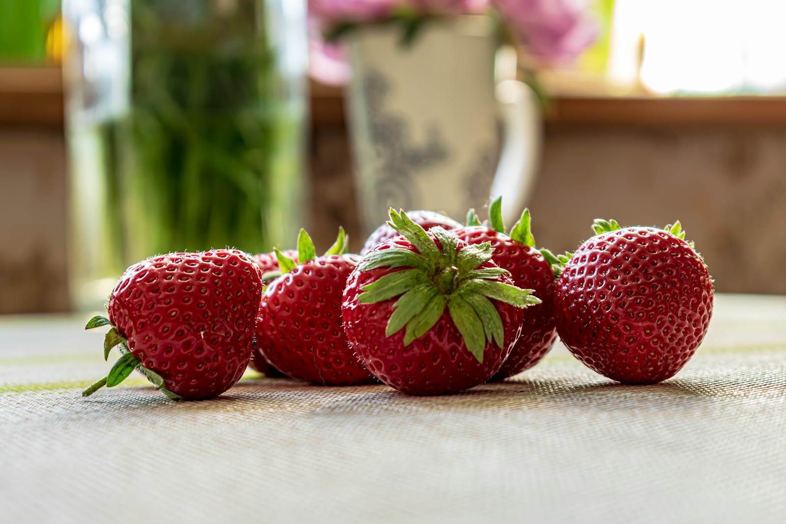 a group of strawberries sitting on top of a table